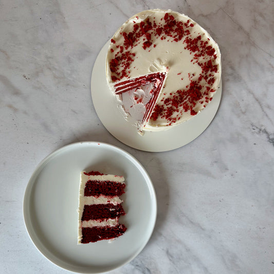 Slice of Red velvet cake filled with cream cheese