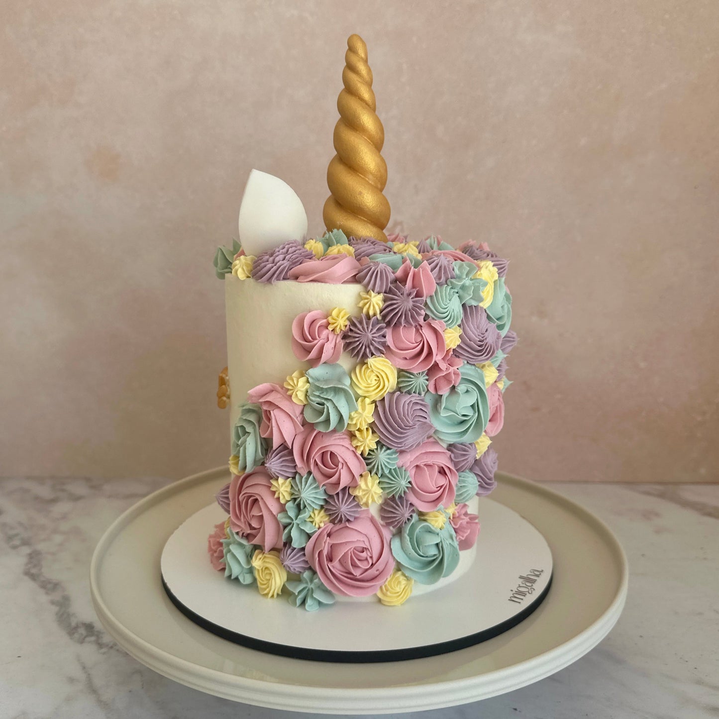 Mane of unicorn cake with buttercream details in pastel colours